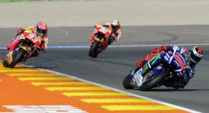 Movistar Yamaha MotoGP's Spanish rider Jorge Lorenzo (R) Repsol Honda Team's Spanish rider Dani Pedrosa and Repsol Honda Team's Spanish rider Marc Marquez (L)  ride during the MotoGP motorcycling race at the Valencia Grand Prix at Ricardo Tormo racetrack in Cheste, near Valencia on November 8, 2015. AFP PHOTO/ JOSE JORDAN