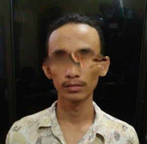 Tersangka JS saat diamankan di Polresta Pekanbaru (**)