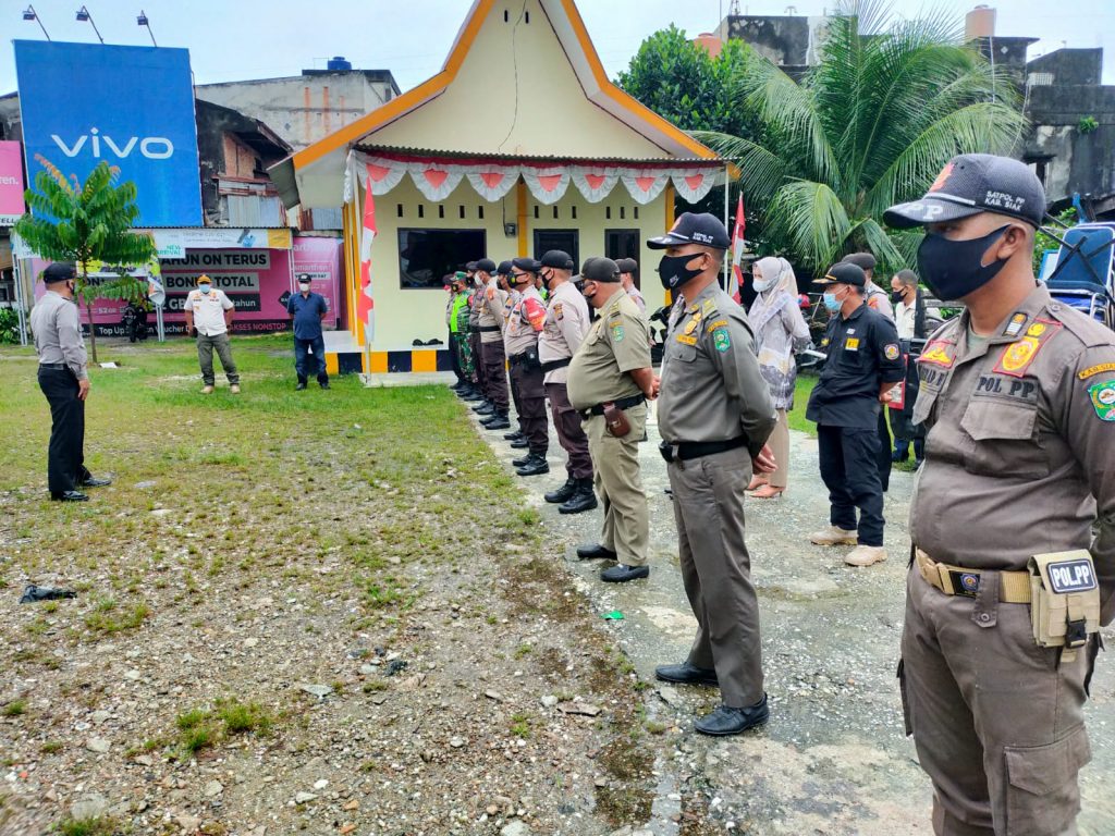 Tim gabungan polri, tni , satpol pp dan dishub kec tualang lakukan penindakan yustisi di pasar tuah seumpun perawang